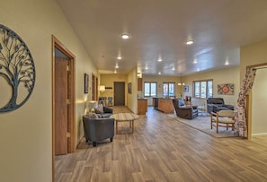 Brand-new hardwood flooring leads throughout the spacious living area.