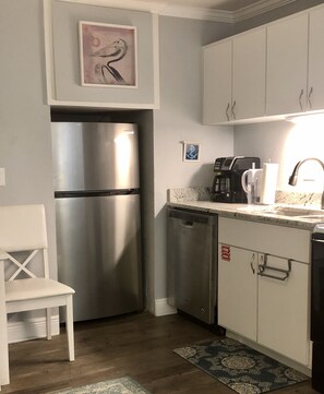 New stainless steel refrigerator and dishwasher. 
