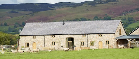 The Longbarn at Caerfallen is a Grade II listed luxury home with stunning views