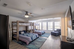 1st floor - custom built bunk beds. (2) queens (2) twins, full bath & fridge