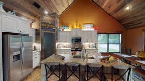 Kitchen area that adjoins with living room