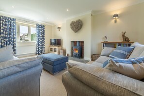 Stone Croft, Barney: Sitting room with wood burning stove