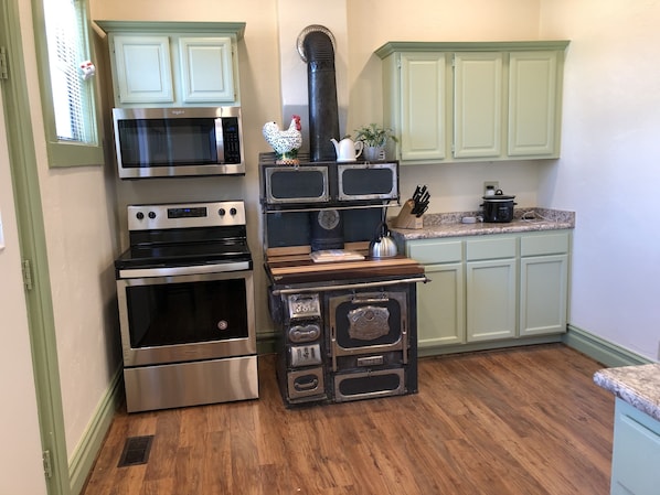 Cute food prep area with a repurposed wood stove. 