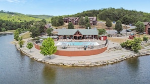 Outdoor community pool by the small lake!