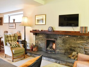 Wonderful feature fireplace with open fire | Yew Tree Farm, Low Newton