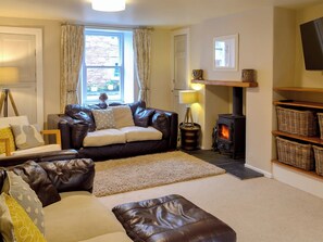 Comfortable living room with wood burner | Maggie&rsquo;s Den, Gatehouse of Fleet
