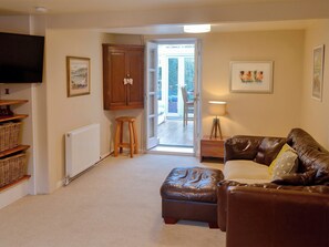 Comfortable living room with wood burner | Maggie&rsquo;s Den, Gatehouse of Fleet