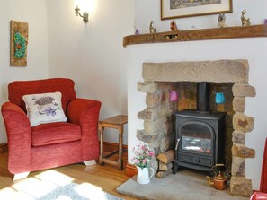 Warming wood burner within living room | Lavender Cottage, Bewerley, near Pateley Bridge