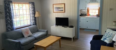 Living room with view to kitchen