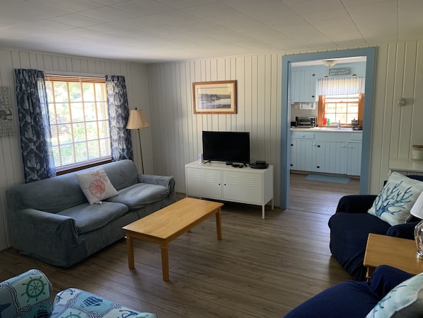 Living room with view to kitchen