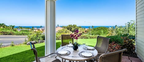 Covered lanai perfect for outdoor meals and to take in the Ocean Views