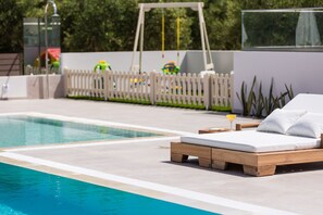 An  outdoor lawn covered playground is available for our younger guests!