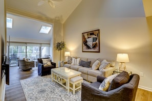 Living room opening up into sun room