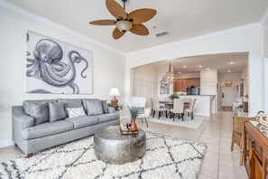 The open concept living and dining areas are the perfect spots to gather together.