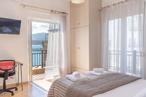 The spacious bedroom offers uninterrupted sea view, ample storage and a laptop friendly work space