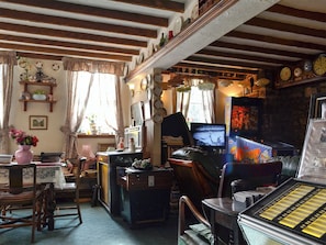 Quirky living room complete with pin ball machine | Chapel Cottage, Pontsticill, Brecon Beacons