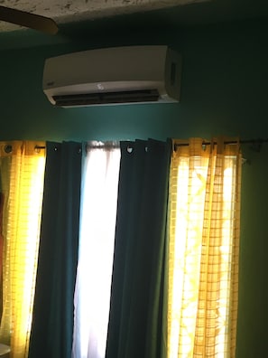 A/C inside room with king size bed