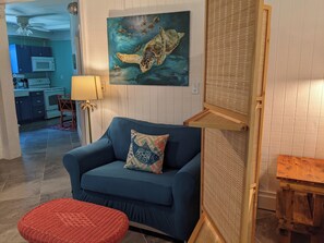 Living area with kitchen in background