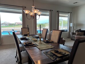 Spacious dining and living room with views of the golf course.