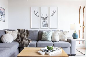 Cozy living room with gas fireplace, seating for 6, patio access to BBQ and view