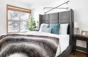Guest bedroom downstairs with queen sized bed and extra memory foam topper.
