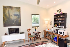 Antique French coffee bar with sink and microwave. Roku smart tv.