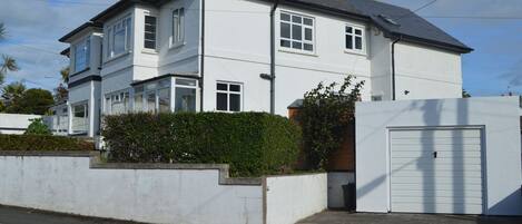 House has large front garden, with shed to store bikes/boards.