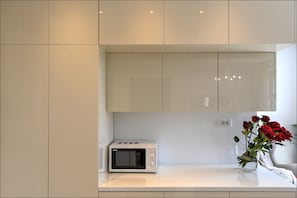 here is microwave and kettle, you can see the fridge, it is inside