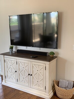 Living Room - 65” SmartTV with sound bar.