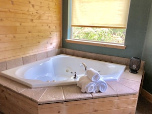 Jacuzzi tub in bedroom