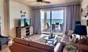 Spacious coastal contemporary living area with endless emerald ocean views