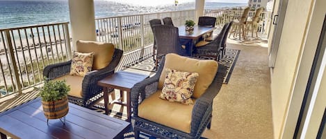 Spacious balcony deck overlooking the water and directly on the beach.