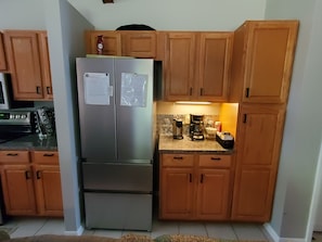 Regular coffee pot and K-cup pot.
New stainless steel refrigerator