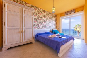 Cozy double bedroom with wardrobe and sea view