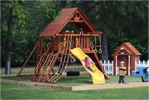 "Outdoor Play Area","Play Area","Playground","Slide","Grass"