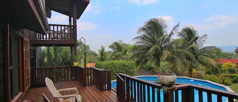 View from Deck overlooking the pool and mountian in the distance