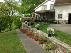 Sidewalk to apt. on 1st level of home. The apt. has its own private entry