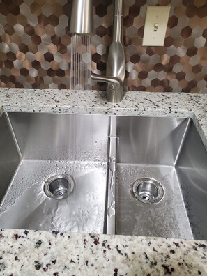 Brand new sink and fixtures. brand new granite counter tops 
