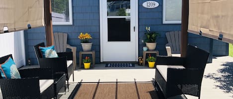 Cozy pergola and porch furniture.  You will find yourself lounging out here