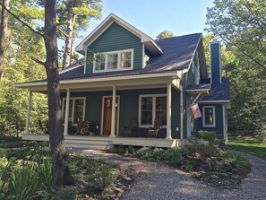 Front of home with large porch on quiet street