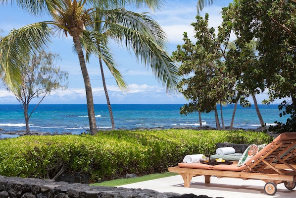 Feel the aloha of the island as you relax on the oceanfront lanai