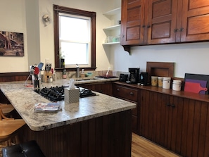 Old style eat-in kitchen with new granite counter.