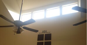 High ceilings welcome the sunlight
French doors lead to back porch and grill