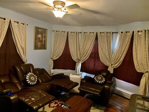 Leather reclining sofas with Blackout curtains 