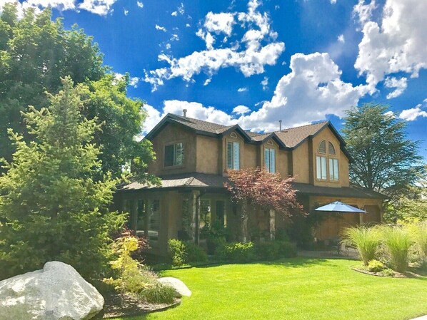 Front of home.  Beautiful landscaping with fountain.