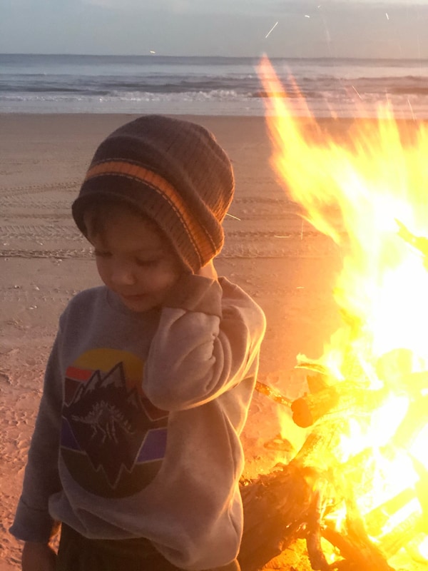 Sunset beach bonfires