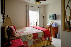Guest room 1, with a firm queen bed.