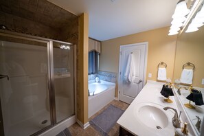 Master bath with separate shower and soaking tub.