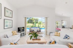 large living room with 2 love seat and sofa