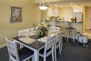 Dining room table for six plus stools at kitchen breakfast bar